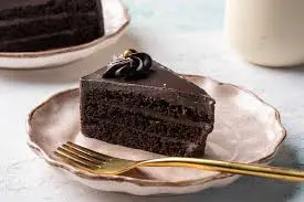 Rich chocolate cake slice from the dessert counter at Chai on 34, Edmonton